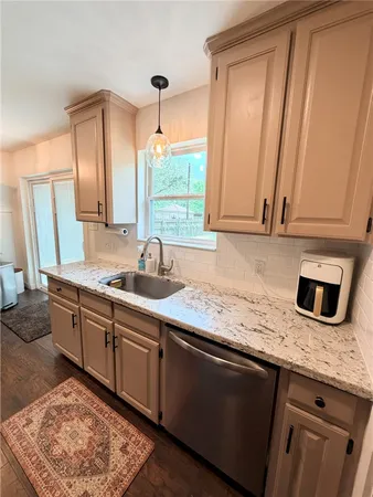 a view of livingroom with washer and dryer