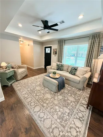 a bedroom with a bed and a chair