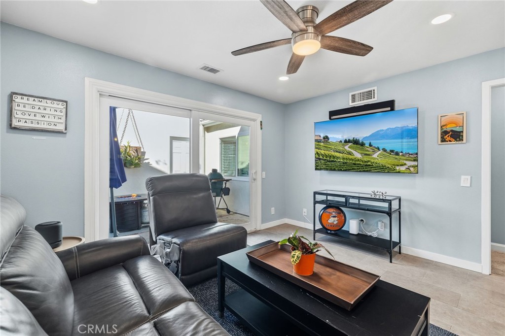7 Spring Buck Irvine, CA 92614 - Photo 14 of 51 a living room with furniture and a flat screen tv