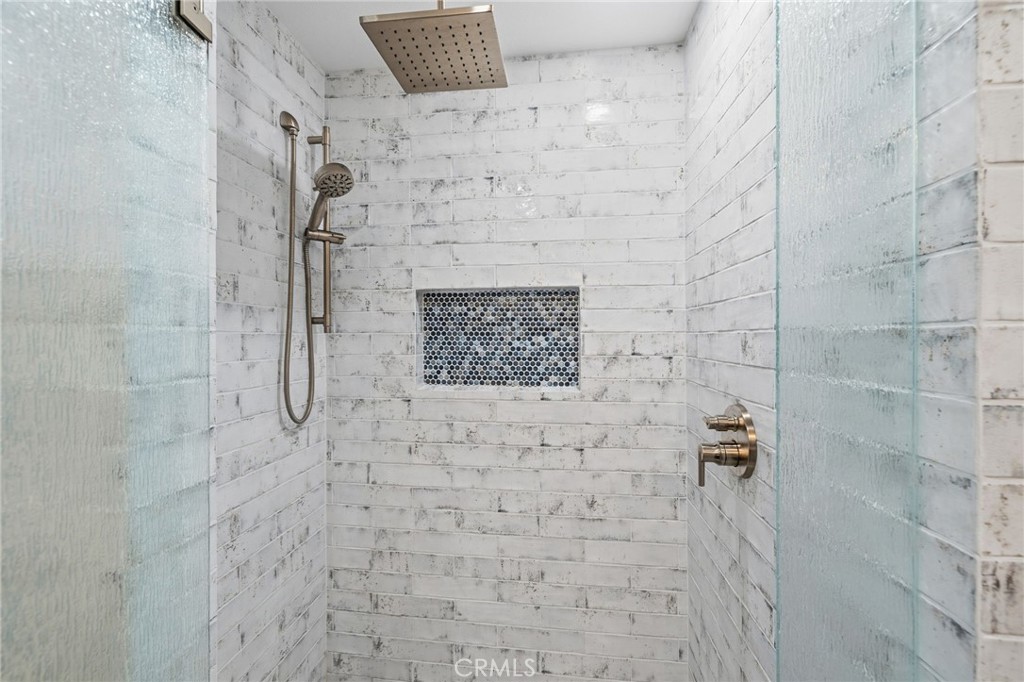 7 Spring Buck Irvine, CA 92614 - Photo 19 of 51 a bathroom with a shower
