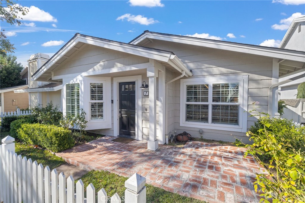 7 Spring Buck Irvine, CA 92614 - Photo 45 of 51 a front view of a house with a yard