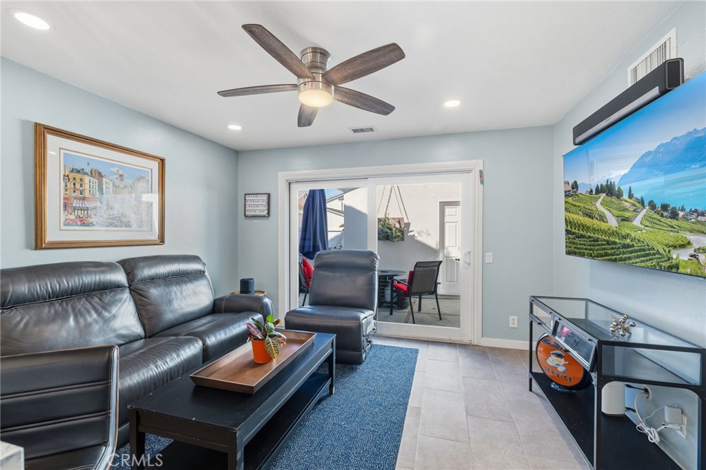 7 Spring Buck Irvine, CA 92614 - Photo 5 of 51 a living room with furniture and a flat screen tv