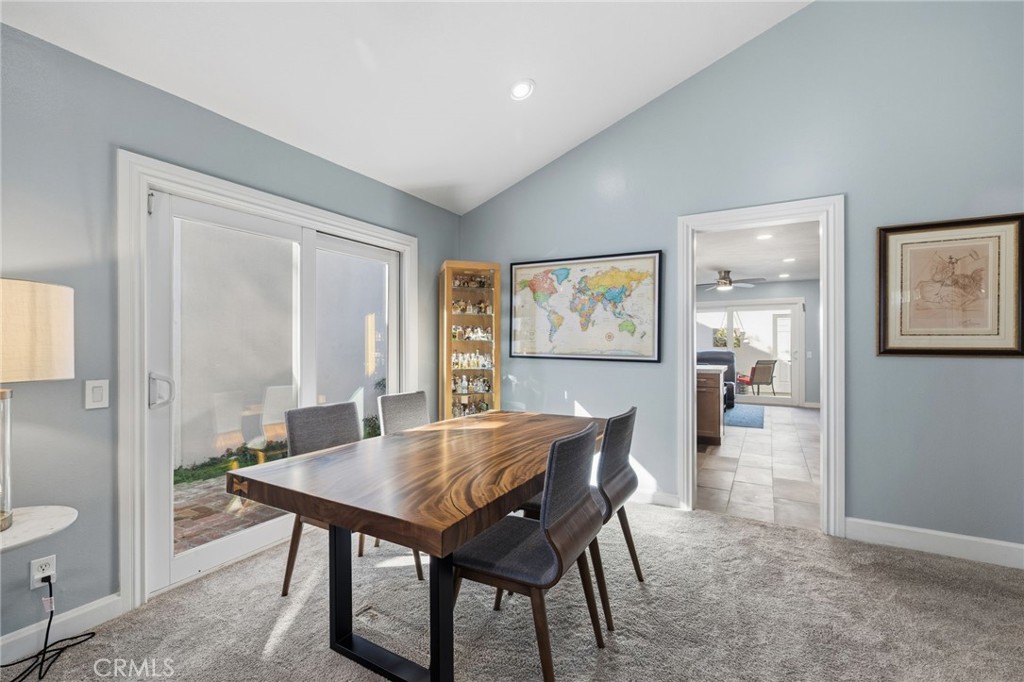 7 Spring Buck Irvine, CA 92614 - Photo 7 of 51 a view of a dining room with furniture and a potted plant