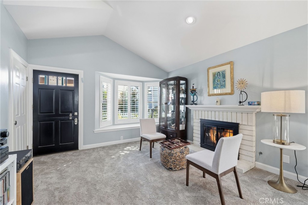 7 Spring Buck Irvine, CA 92614 - Photo 9 of 51 a living room with furniture and a fireplace