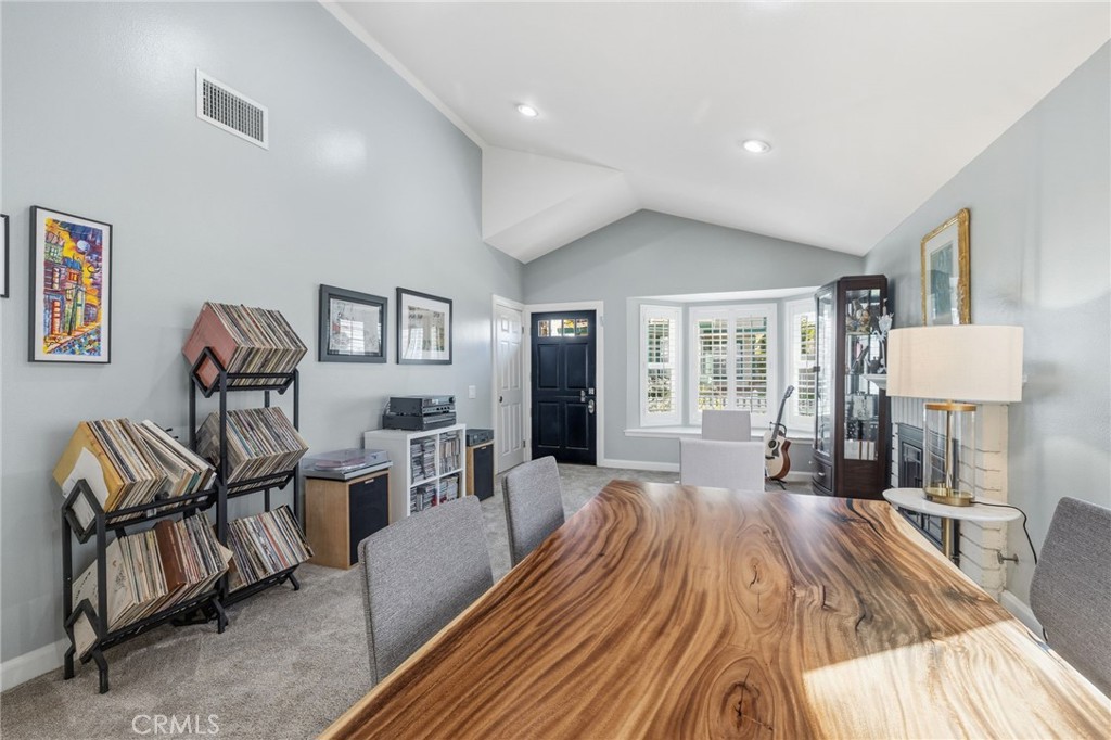 7 Spring Buck Irvine, CA 92614 - Photo 10 of 51 a living room with furniture and a wooden floor