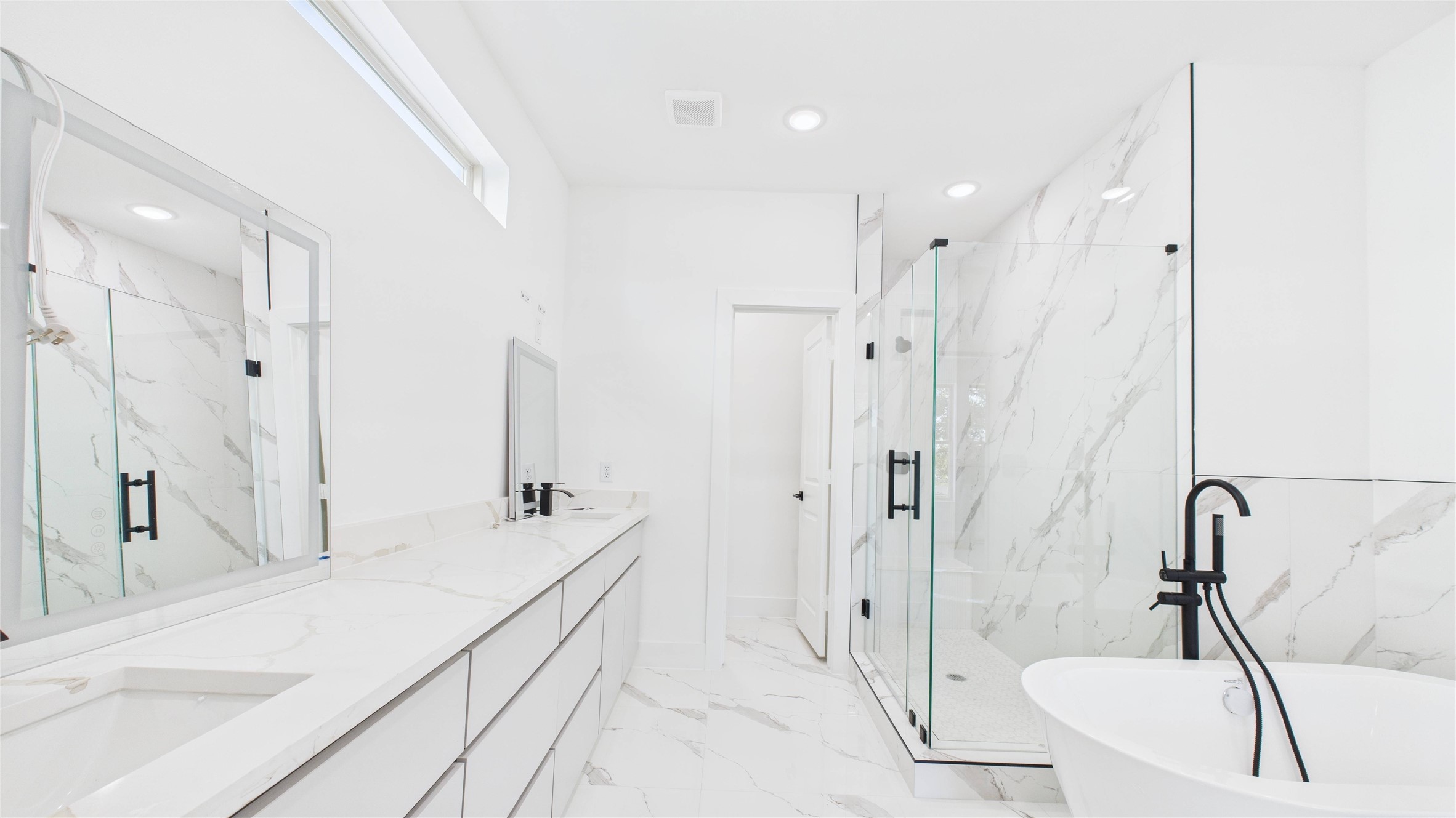 5318 Terry Street Houston, TX 77009 - Photo 23 of 28 a bathroom with a double vanity sink a mirror and shower