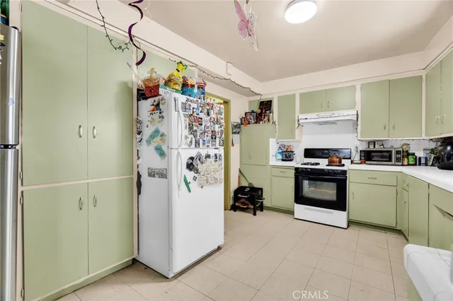 a bathroom with a sink mirror vanity and toilet