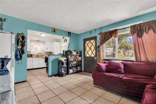 a bedroom with a bed and a mirror on dresser