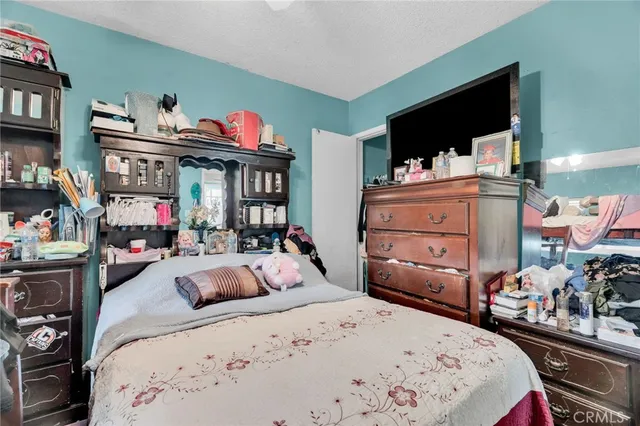 a bedroom with furniture and a bed