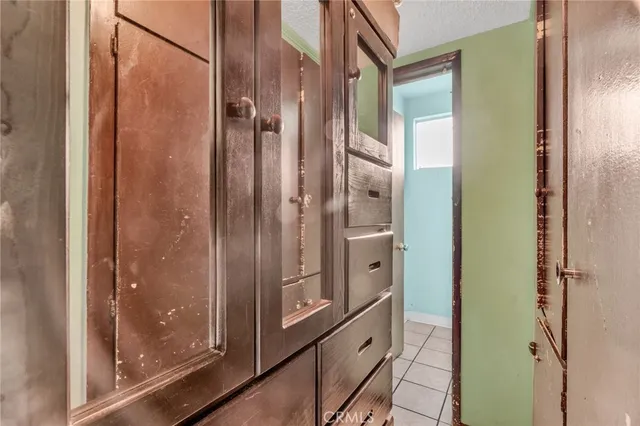 a bedroom with two beds and a window