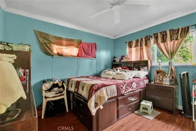 a view of a workspace with furniture and a potted plant
