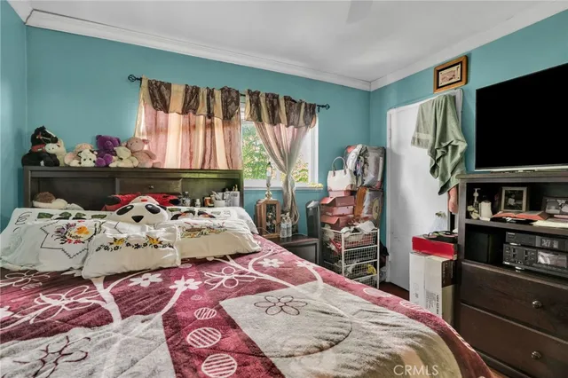 a room with furniture and a flat screen tv