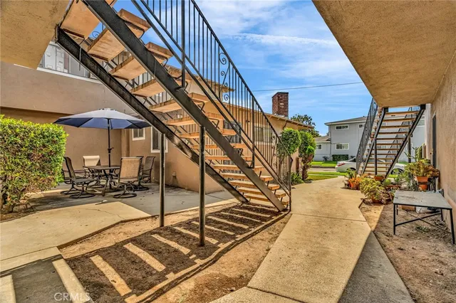 a view of a house with pool and wooden floor