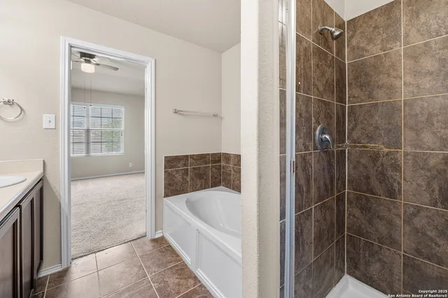 a bathroom with a bathtub and shower