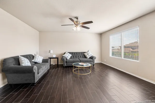 a living room with furniture and a window