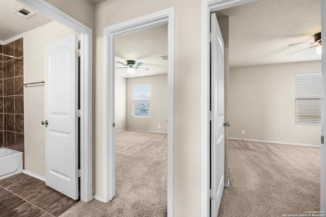 a view of a bathroom with a shower and a sink