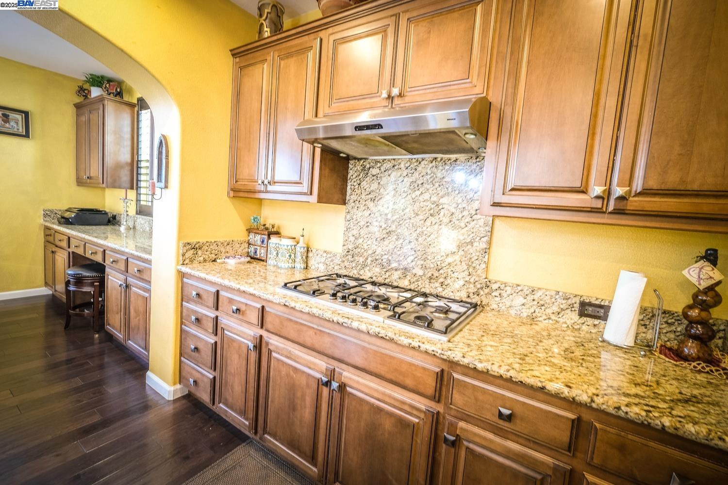 3252 Carpenter Way San Ramon, CA 94582 - Photo 18 of 58 a kitchen with stainless steel appliances granite countertop a stove and a sink