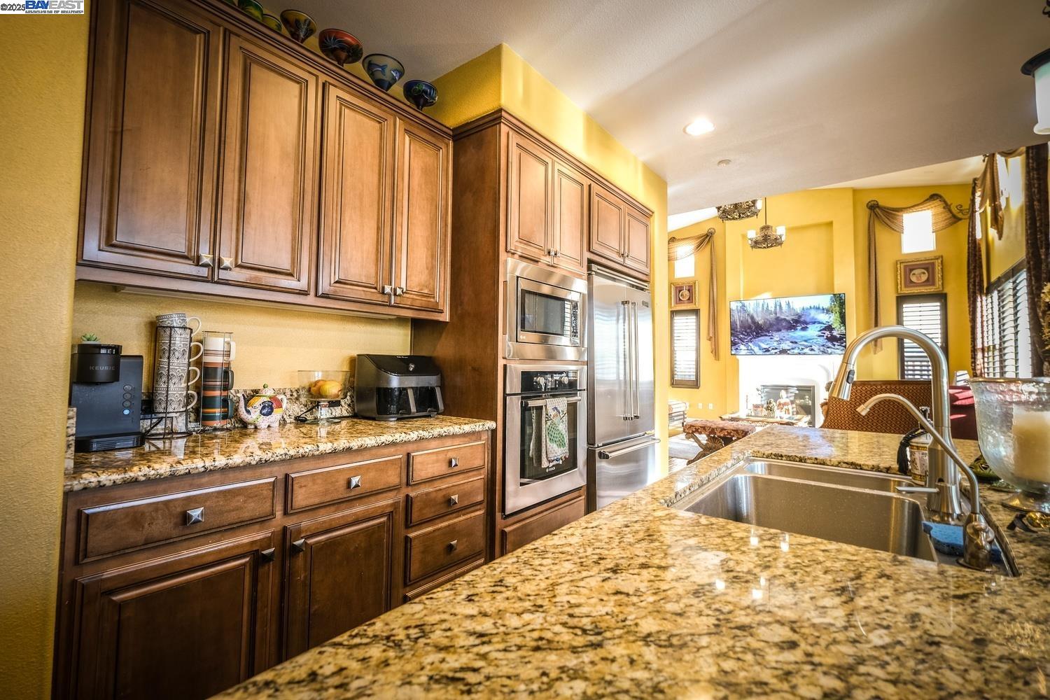 3252 Carpenter Way San Ramon, CA 94582 - Photo 19 of 58 a kitchen with stainless steel appliances granite countertop a sink stove and refrigerator