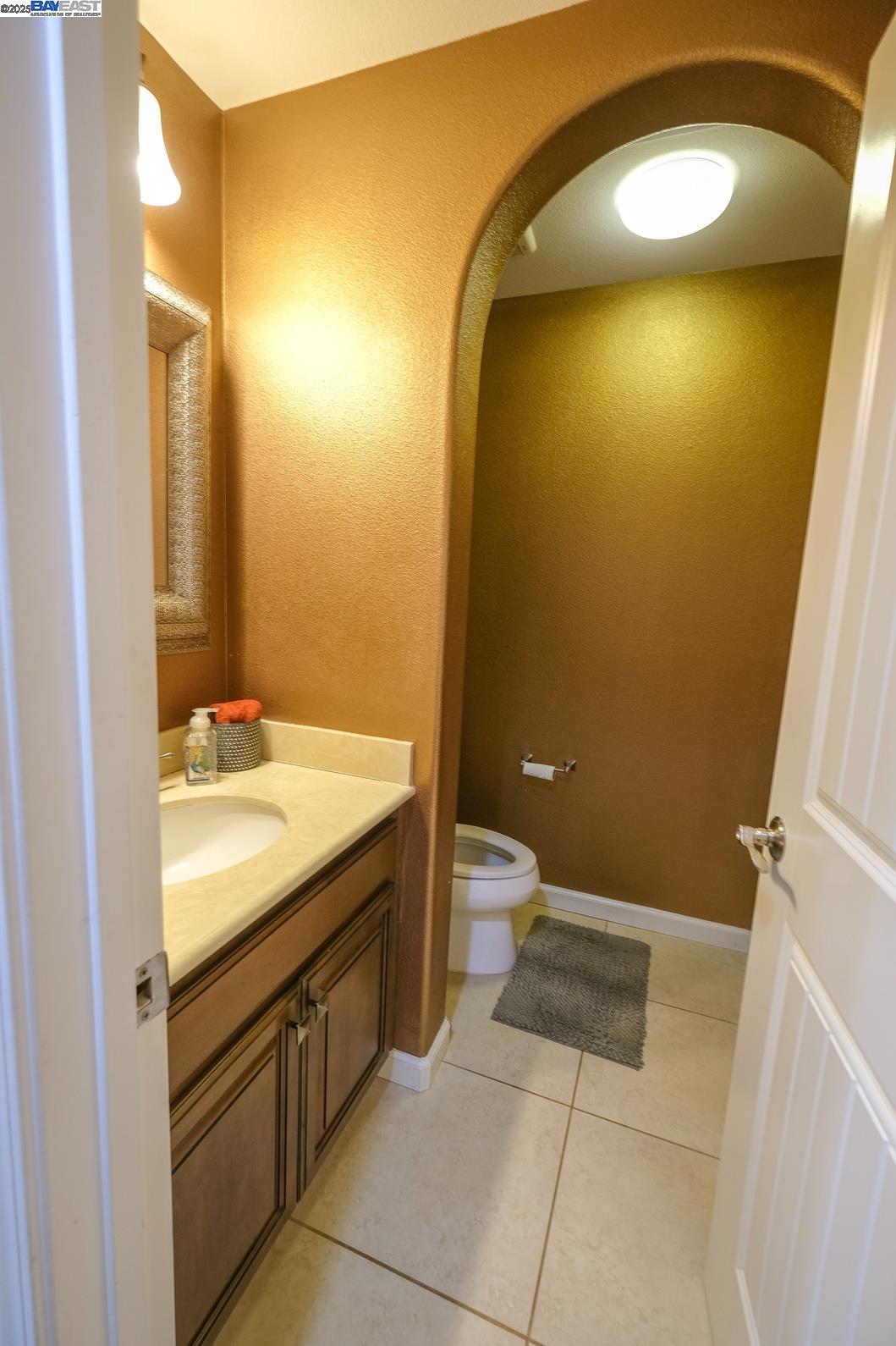 3252 Carpenter Way San Ramon, CA 94582 - Photo 25 of 58 a bathroom with a granite countertop sink and a mirror