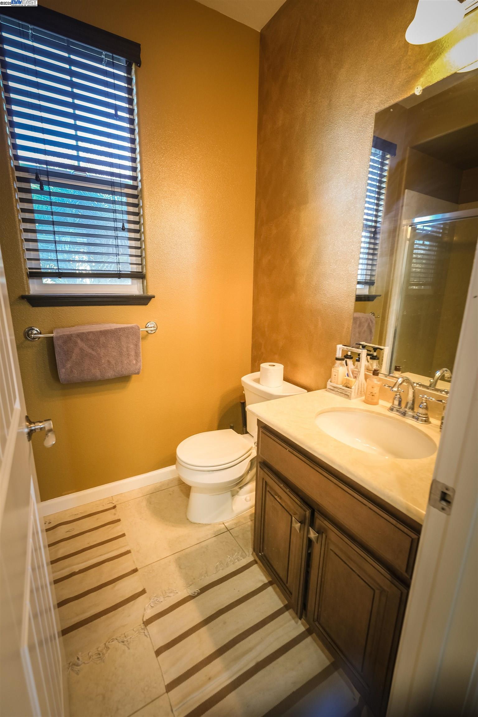 3252 Carpenter Way San Ramon, CA 94582 - Photo 9 of 58 a bathroom with a sink and a mirror