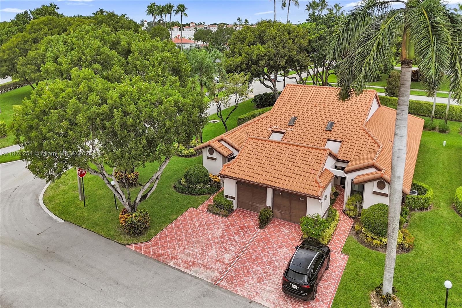 6139 Sunrise Pointe Court, Unit A Delray Beach, FL 33484 - Photo 2 of 41 an aerial view of a house with a yard and potted plants