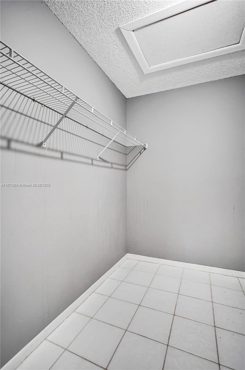 6139 Sunrise Pointe Court, Unit A Delray Beach, FL 33484 - Photo 27 of 41 a view of a room with racks on the wall