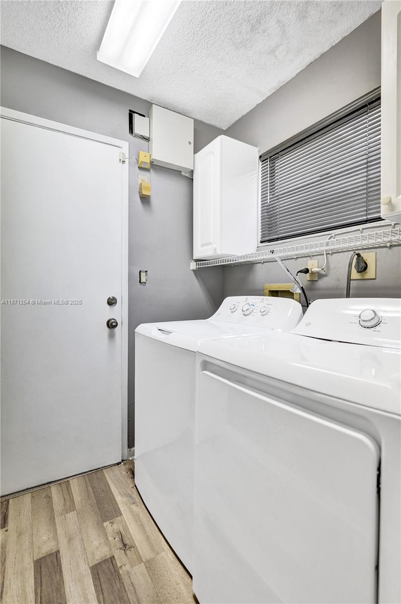 6139 Sunrise Pointe Court, Unit A Delray Beach, FL 33484 - Photo 36 of 41 a utility room with dryer and washer