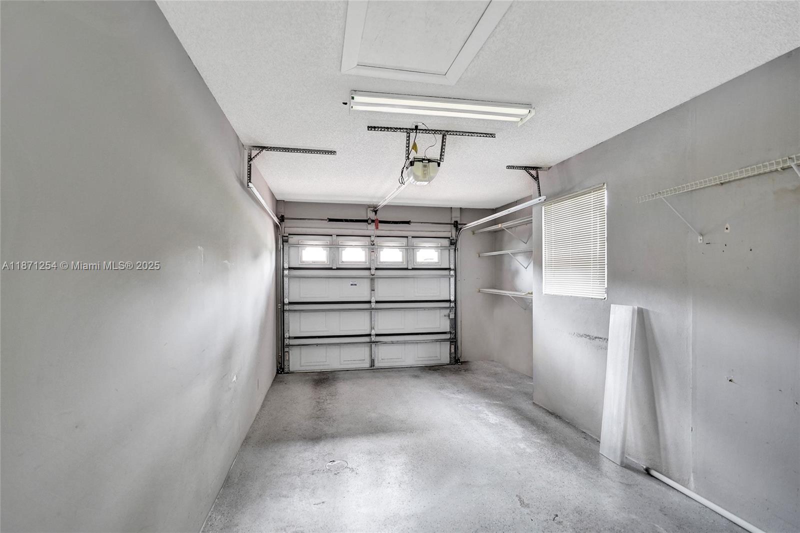 6139 Sunrise Pointe Court, Unit A Delray Beach, FL 33484 - Photo 37 of 41 a view of store room with racks