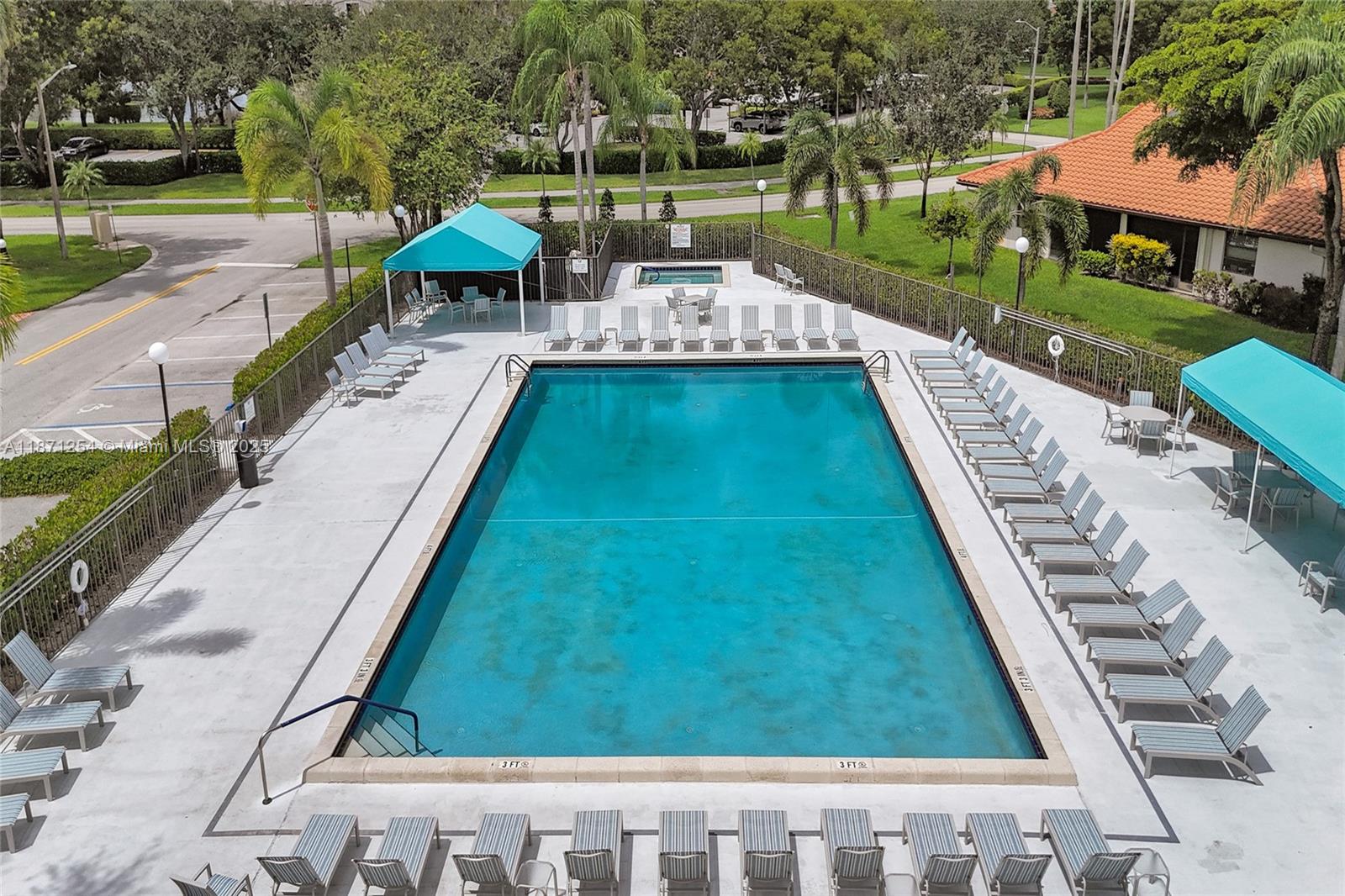 6139 Sunrise Pointe Court, Unit A Delray Beach, FL 33484 - Photo 7 of 41 a view of a swimming pool with a patio