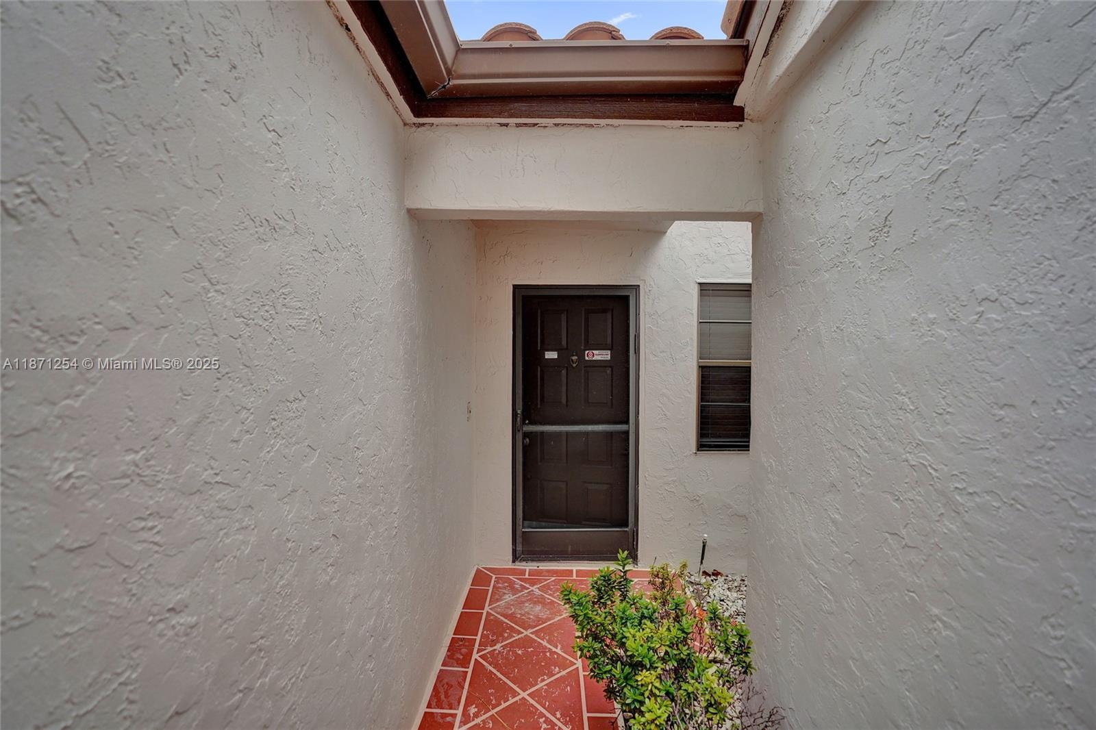 6139 Sunrise Pointe Court, Unit A Delray Beach, FL 33484 - Photo 9 of 41 a view of front door