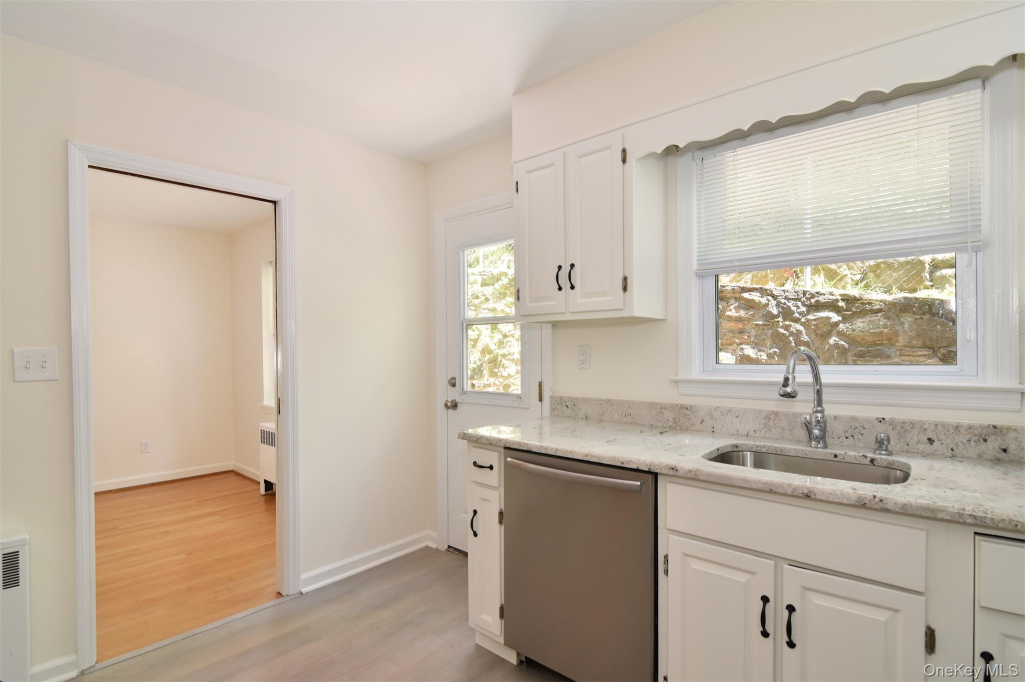 74 Briary Road Dobbs Ferry, NY 10522 - Photo 9 of 19 Kitchen with door out to patio for convenient summer grilling.