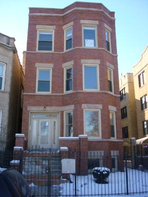 3147 West Augusta Boulevard, Unit 3 Chicago, IL 60622 - Photo 1 of 1 a front view of a building with glass windows