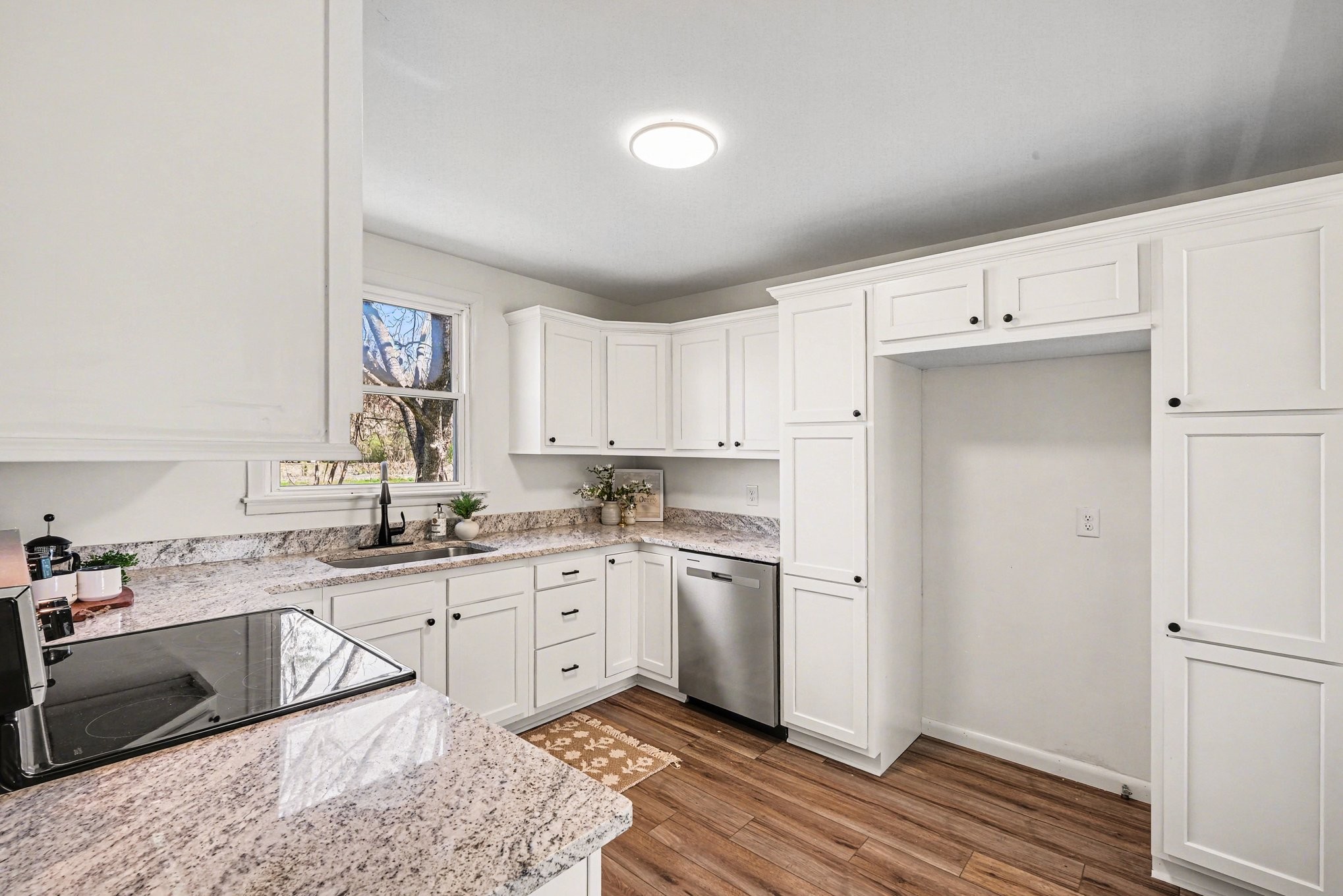 1307 Atlas Street Murfreesboro, TN 37130 - Photo 9 of 24 a kitchen with a sink cabinets and window