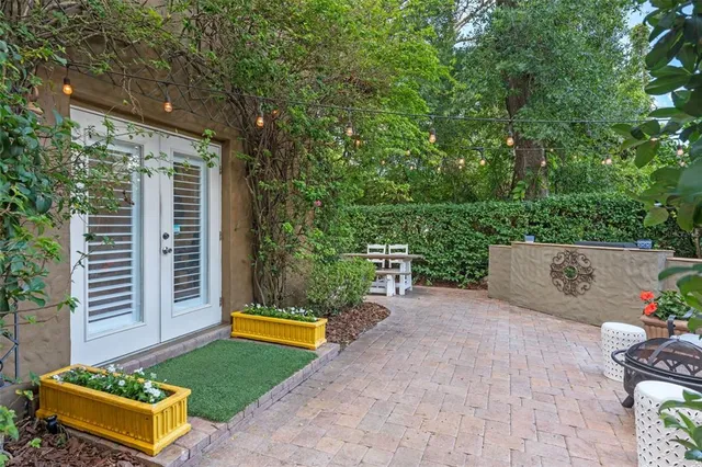 a view of a backyard with sitting area