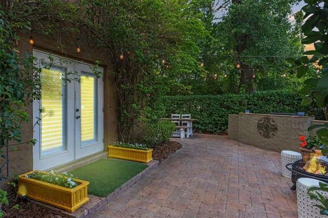 a view of a two chairs in the patio