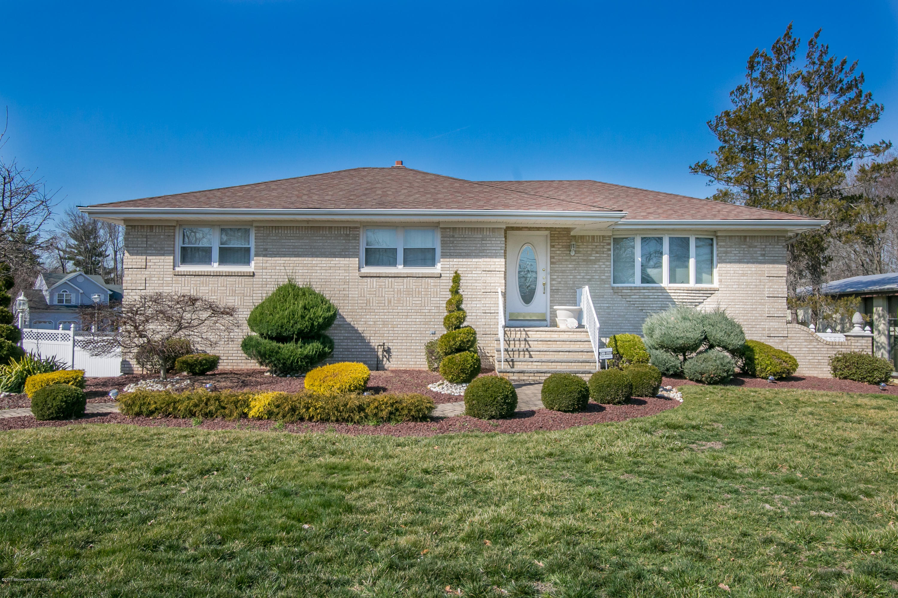 473 Lloyd Road Aberdeen, NJ 07747 - Photo 1 of 34 a front view of a house with a garden
