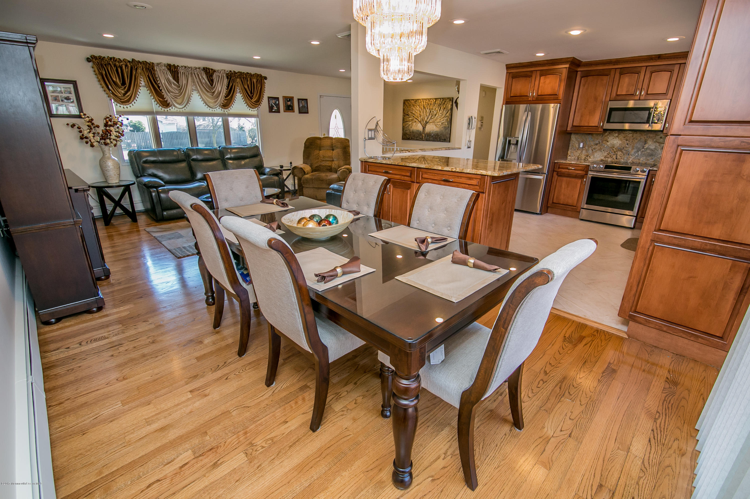 473 Lloyd Road Aberdeen, NJ 07747 - Photo 11 of 34 a view of a dining room with furniture and wooden floor