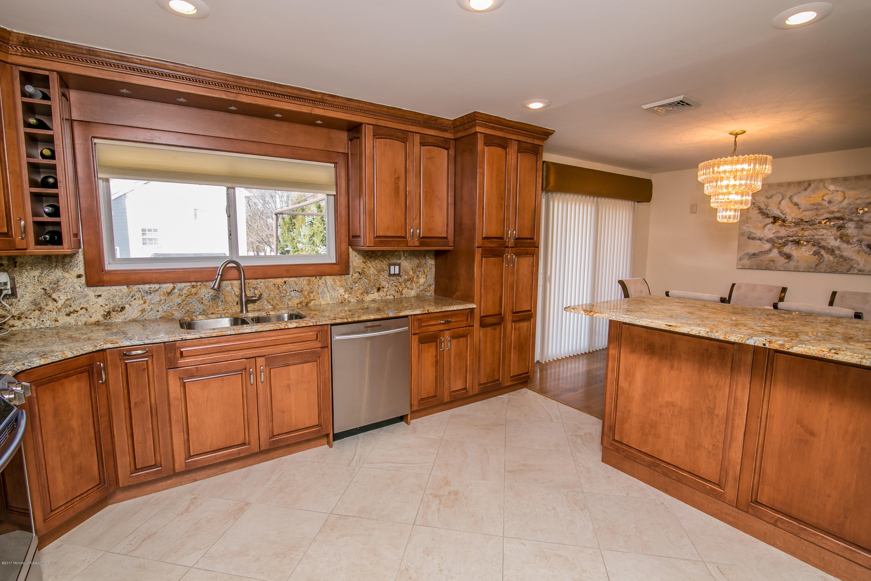 473 Lloyd Road Aberdeen, NJ 07747 - Photo 13 of 34 a large kitchen with granite countertop a sink and a window