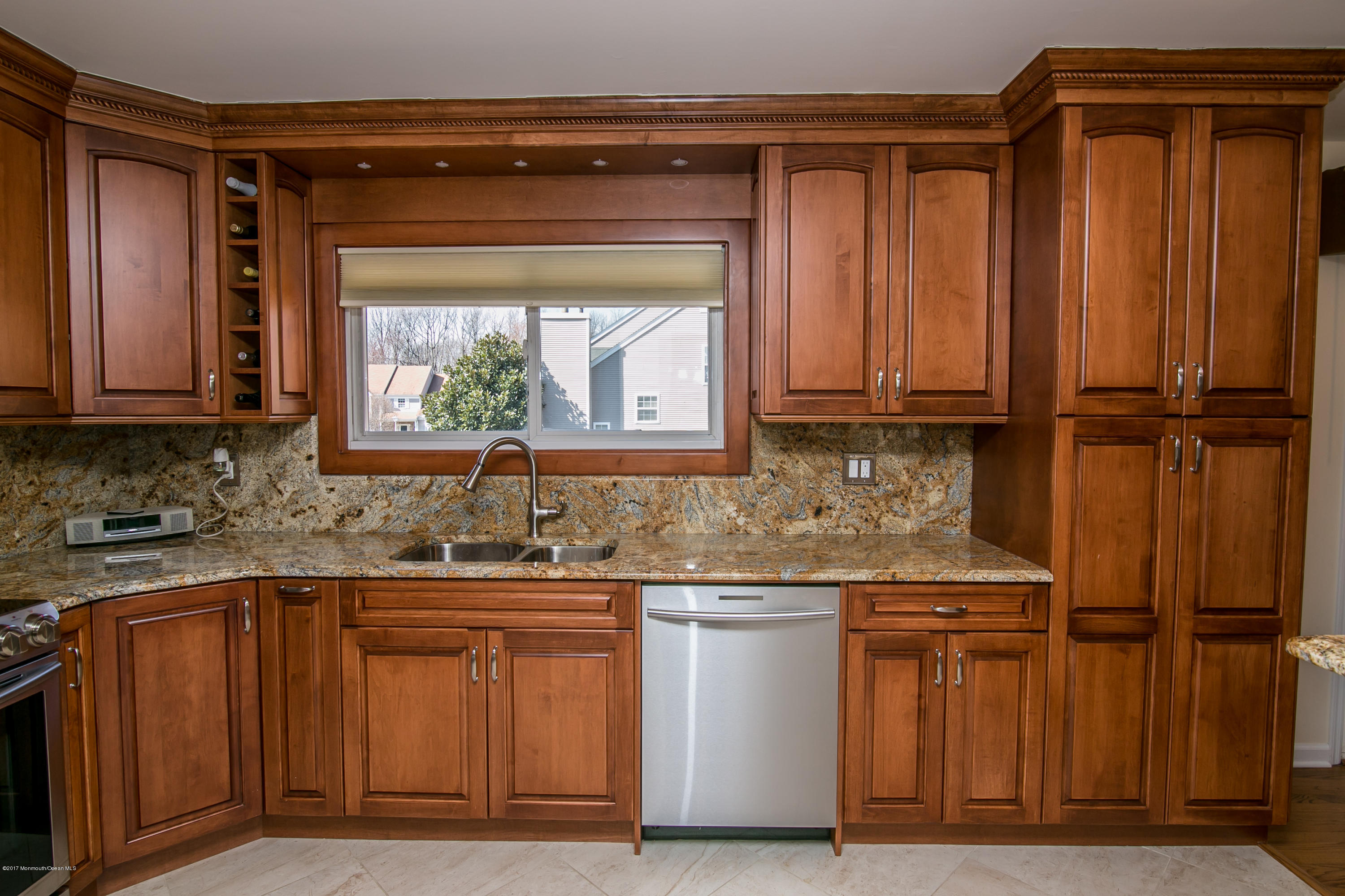 473 Lloyd Road Aberdeen, NJ 07747 - Photo 16 of 34 a kitchen with stainless steel appliances granite countertop a sink and a microwave