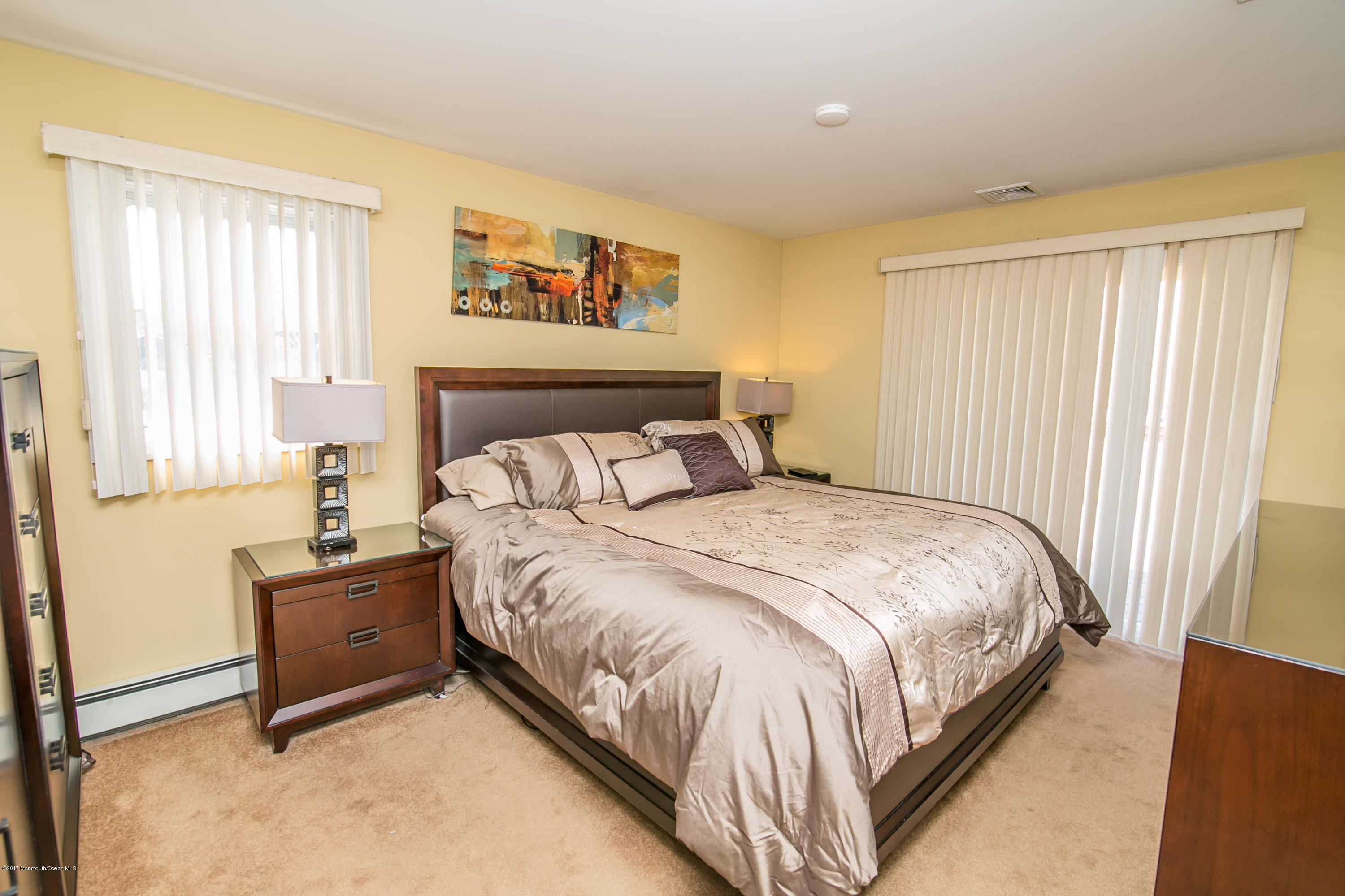 473 Lloyd Road Aberdeen, NJ 07747 - Photo 17 of 34 a bedroom with a bed and window