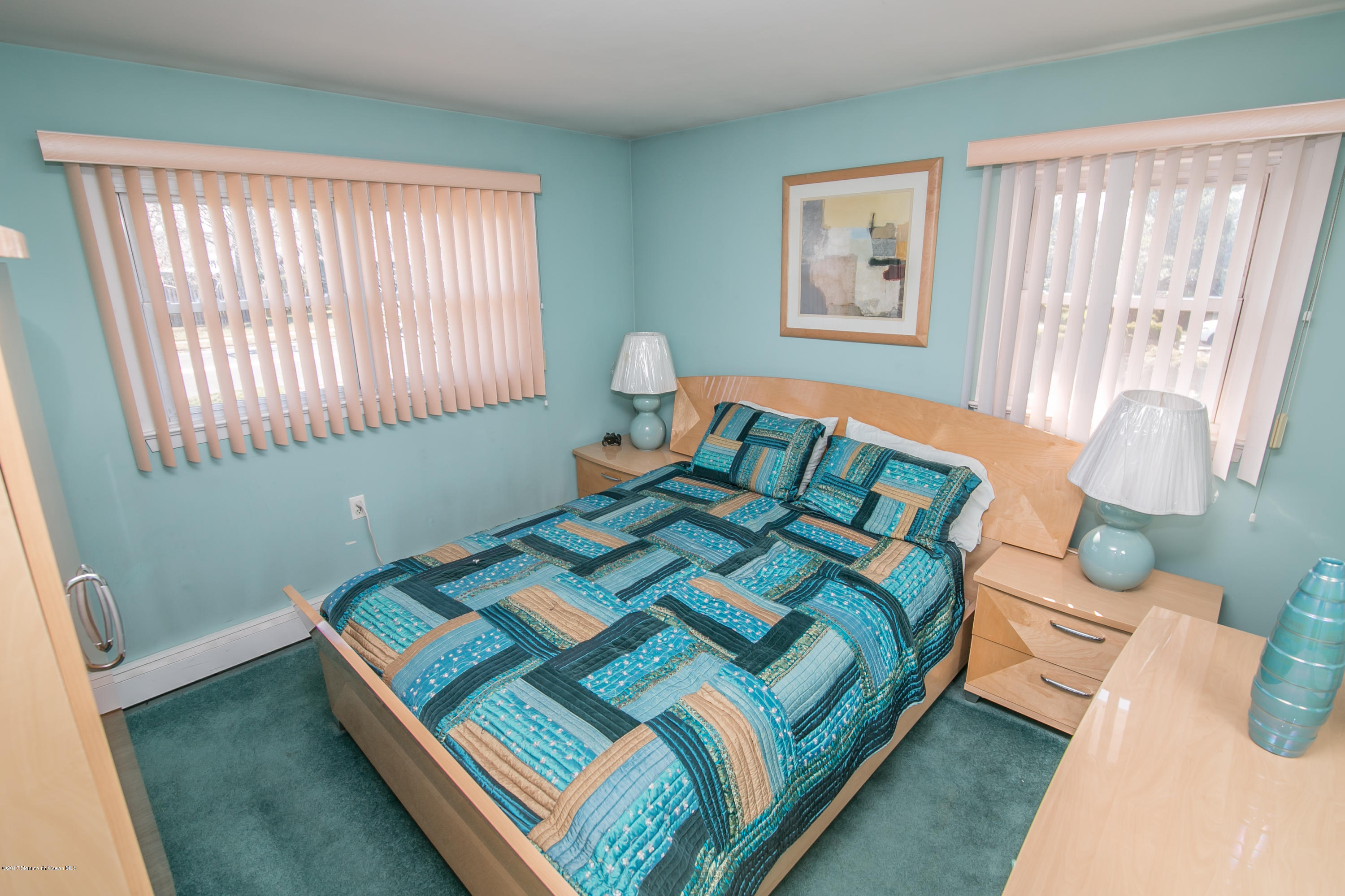 473 Lloyd Road Aberdeen, NJ 07747 - Photo 21 of 34 a bedroom with a bed and a window
