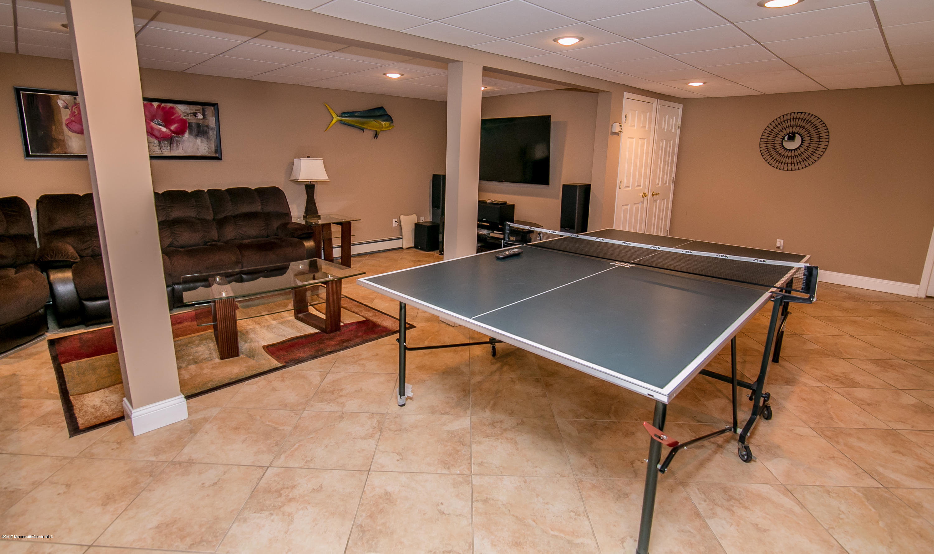 473 Lloyd Road Aberdeen, NJ 07747 - Photo 27 of 34 a living room with pool table and a flat screen tv