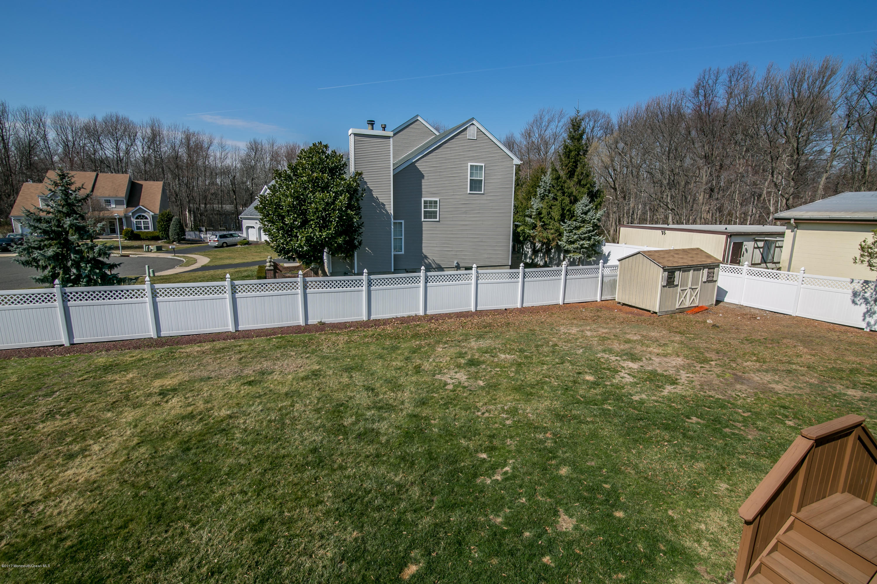 473 Lloyd Road Aberdeen, NJ 07747 - Photo 30 of 34 a view of a house with backyard and trees