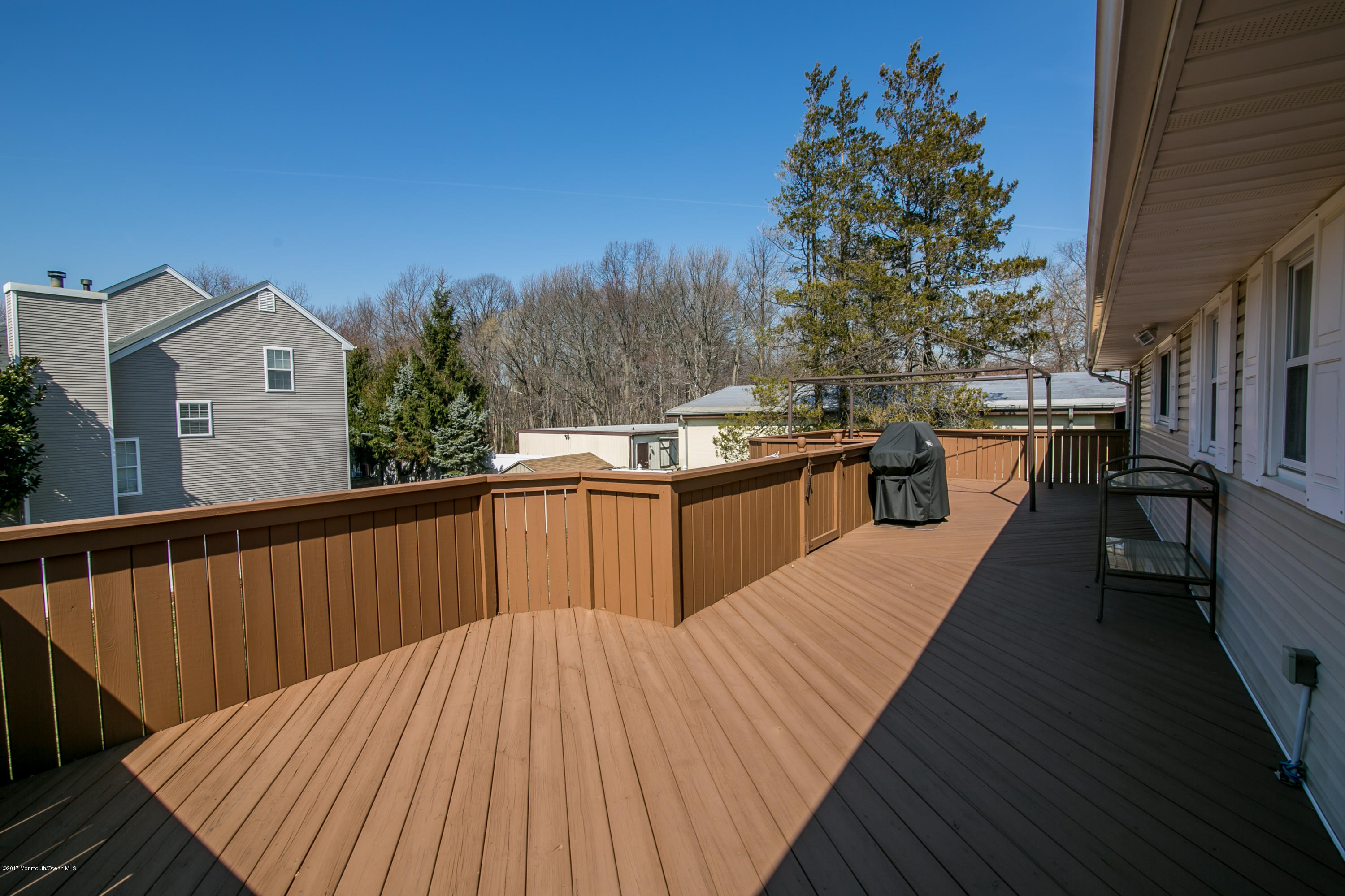 473 Lloyd Road Aberdeen, NJ 07747 - Photo 31 of 34 a view of balcony with wooden floor and outdoor seating
