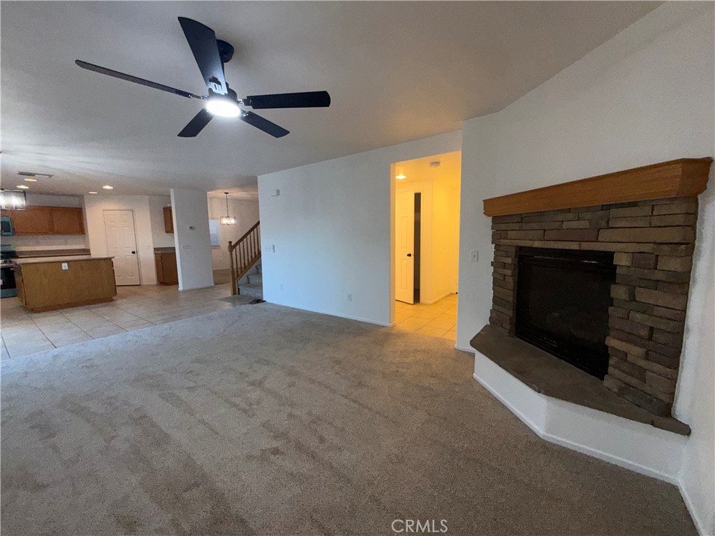 29162 Hydrangea Street Murrieta, CA 92563 - Photo 13 of 46 a view of a livingroom with a fireplace and a window