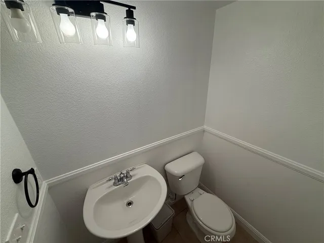 a bathroom with a toilet and a sink