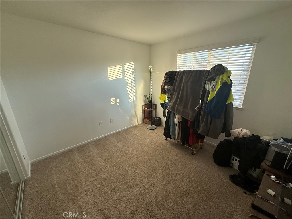 29162 Hydrangea Street Murrieta, CA 92563 - Photo 19 of 46 a view of walk in closet with clothes and shoes