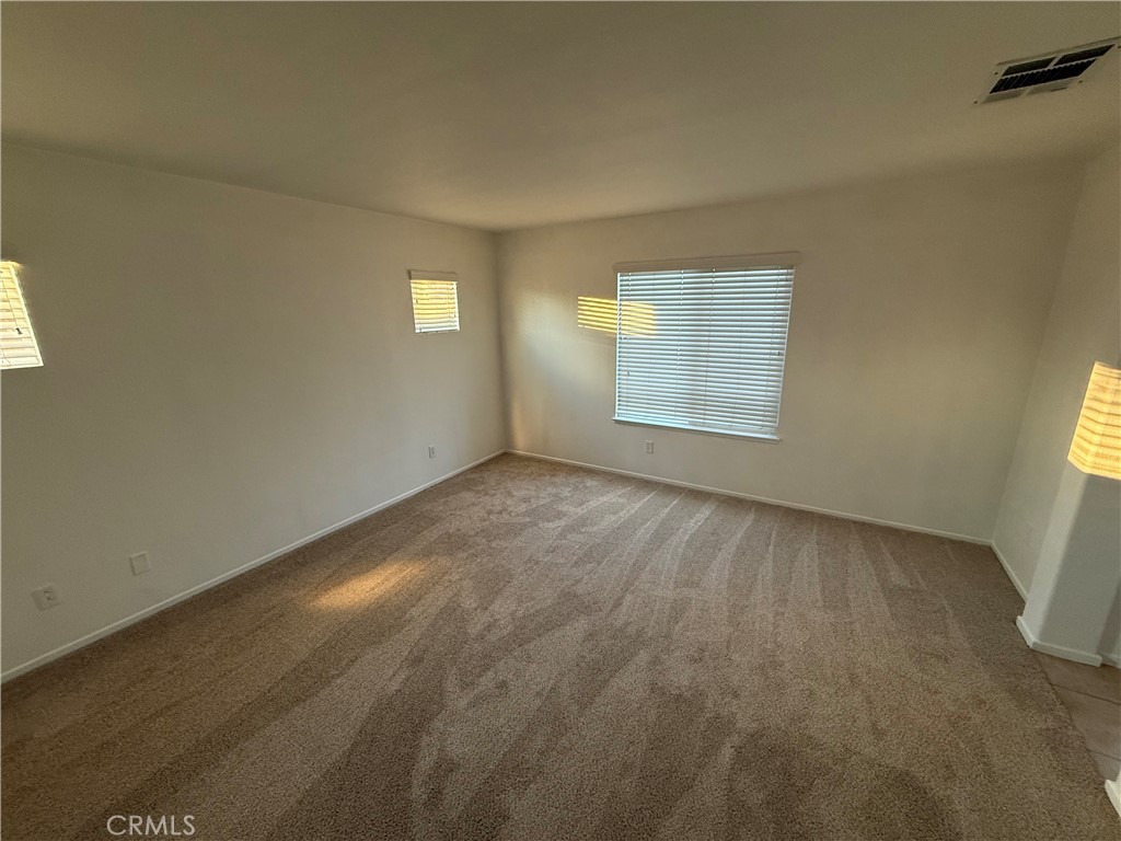 29162 Hydrangea Street Murrieta, CA 92563 - Photo 23 of 46 a view of an empty room with a window