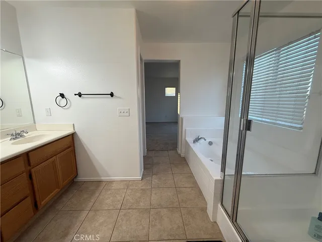 a bathroom with a double vanity sink and mirror