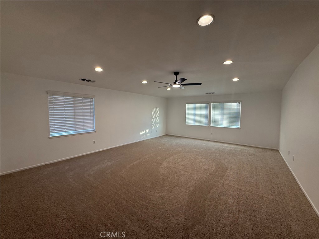 29162 Hydrangea Street Murrieta, CA 92563 - Photo 34 of 46 an empty room with a empty space and windows